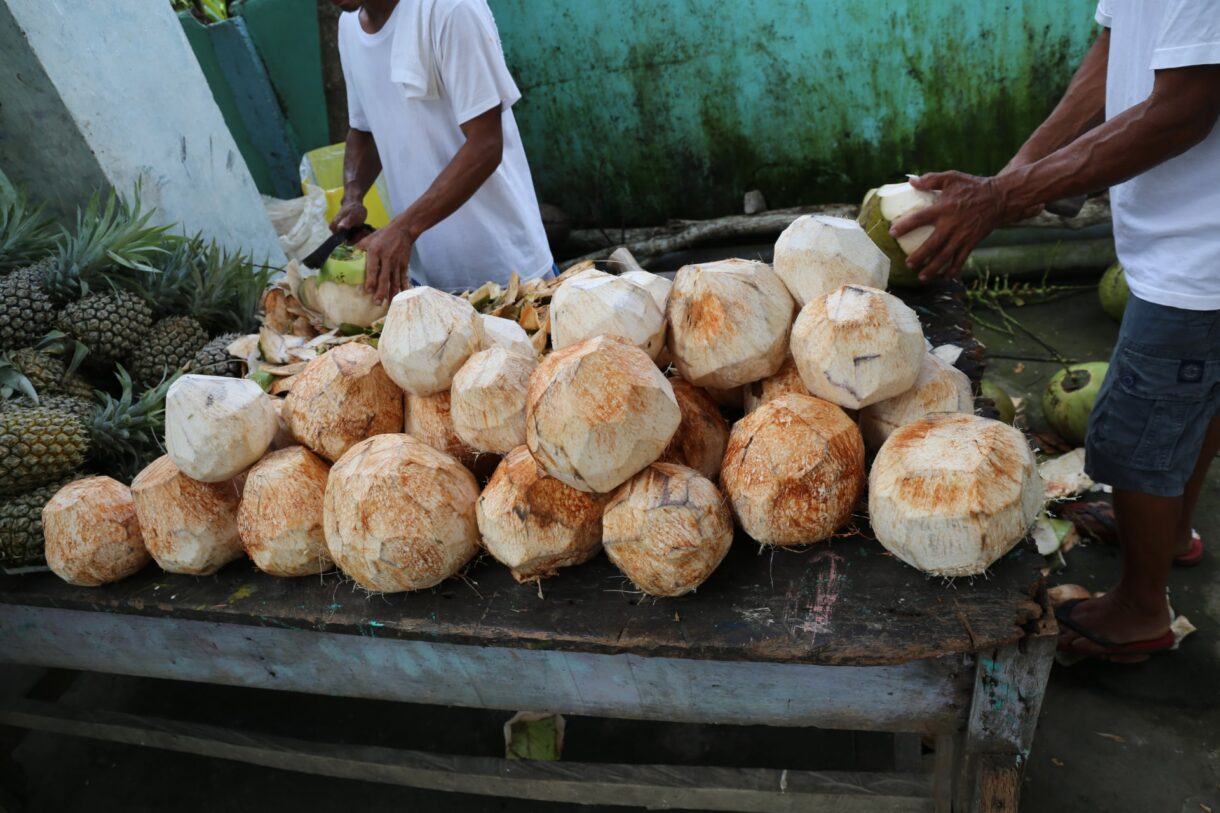 Coconuts being cut