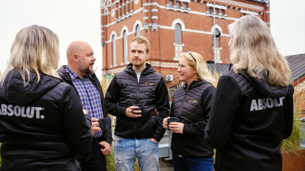 People talking outside of the distillery