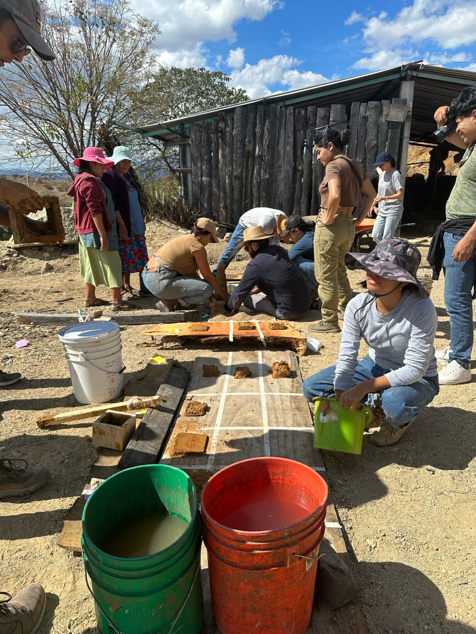 Image of people building kitchens and patios using mezcal by-products