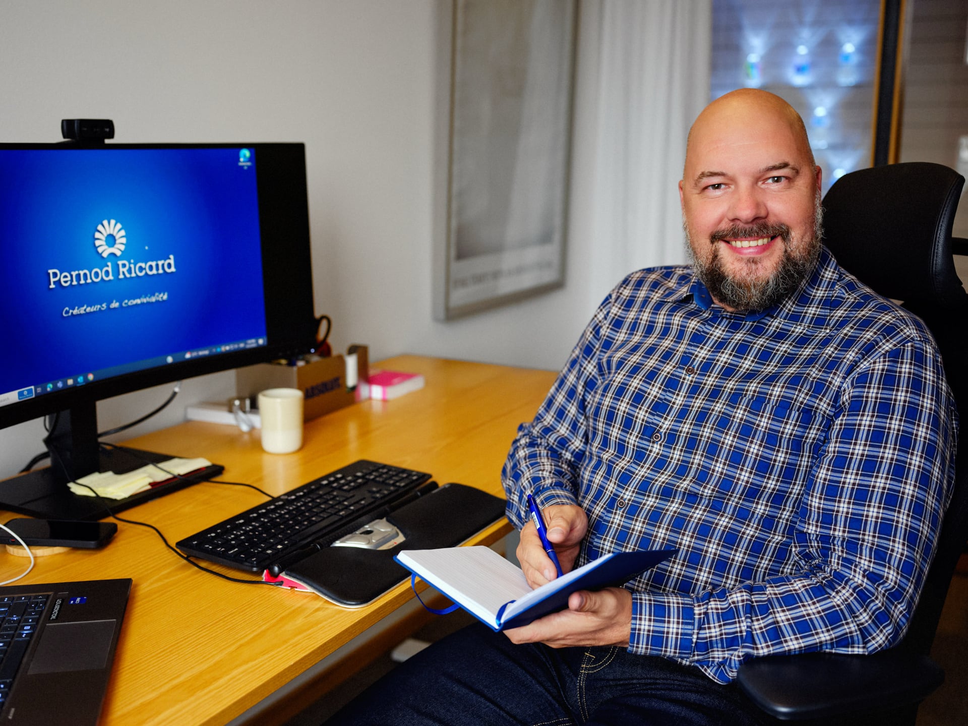 Dainius Januskevicius, Health & Safety manager at Absolut Vodka, sitting at desk