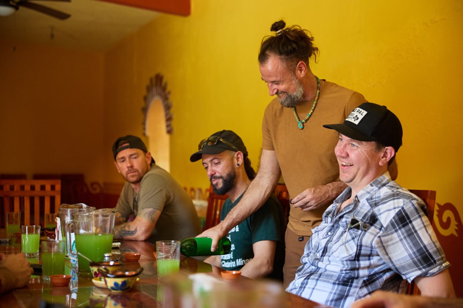 Image of people working on Del Maguey talking