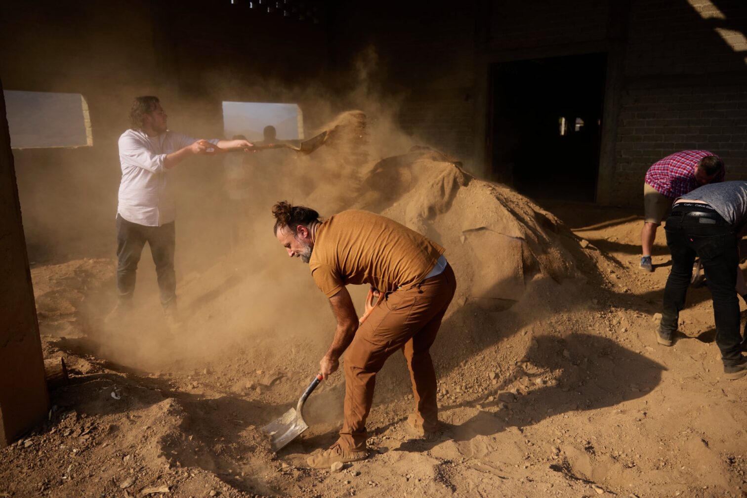 Image of people building kitchens and patios using mezcal by-products