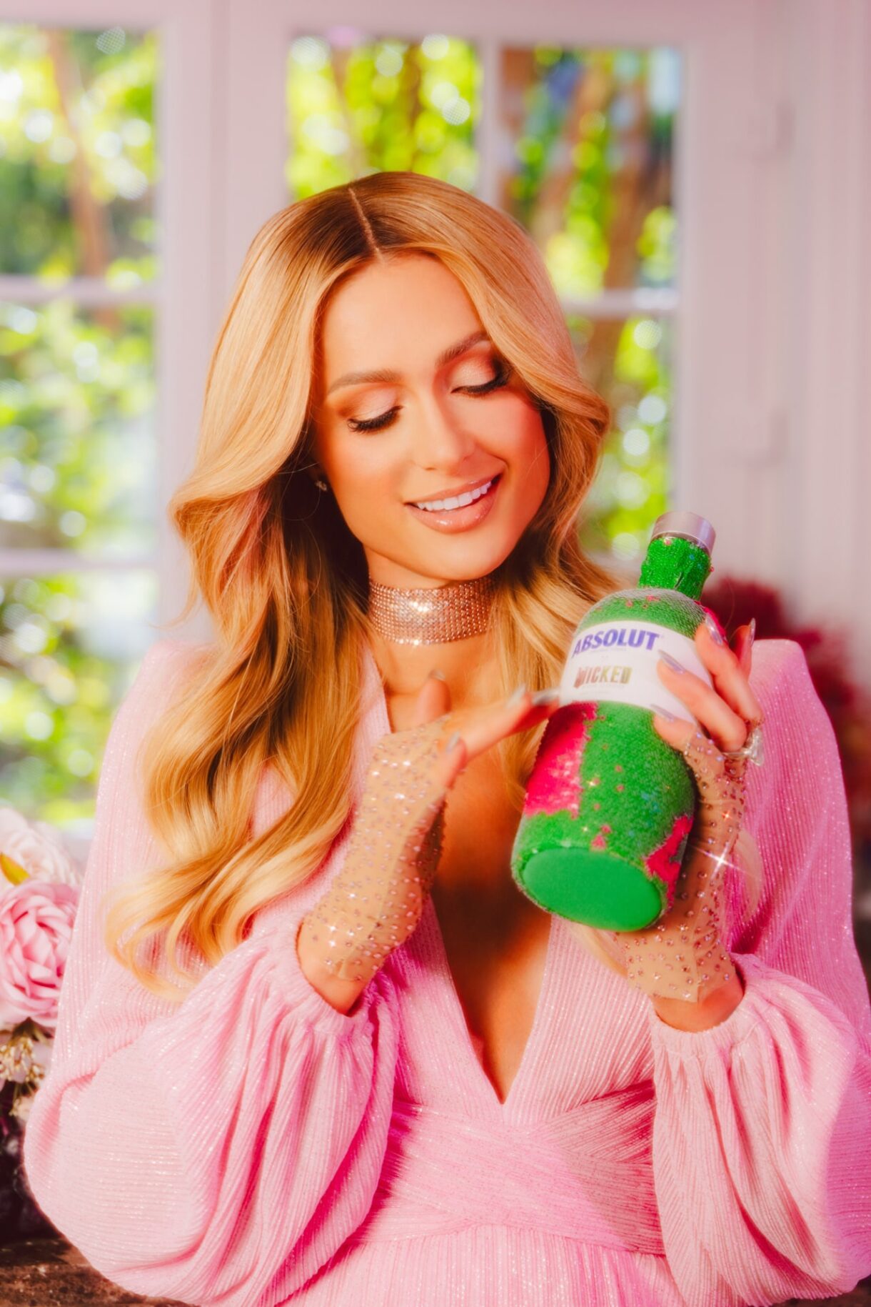 Paris Hilton holding the Absolut Wicked bottle sleeve